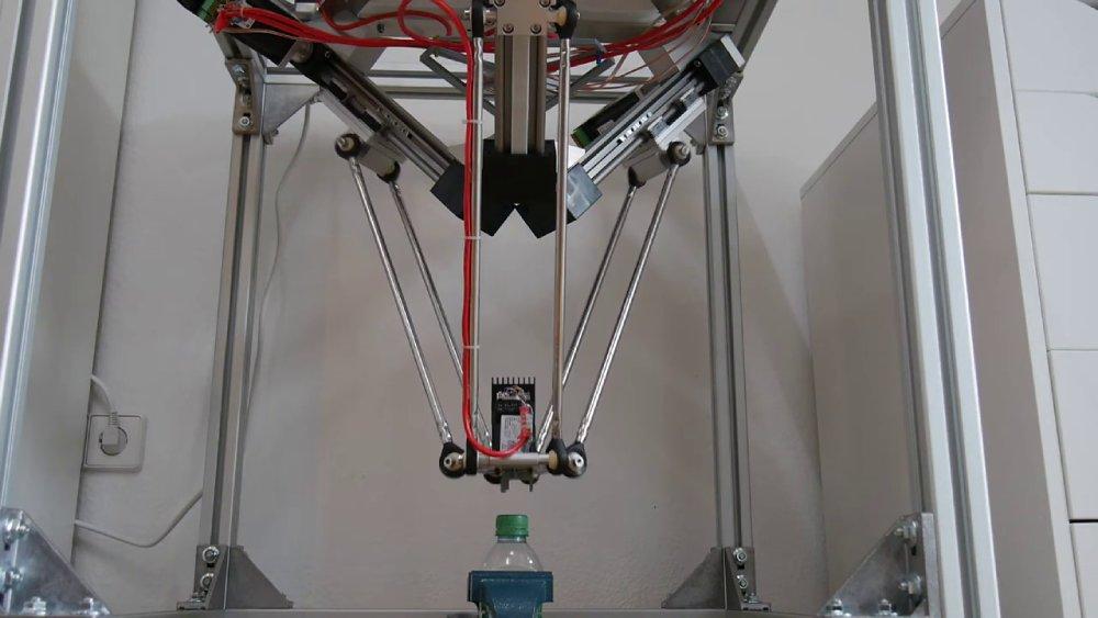 Precise unscrewing of a bottle cap with a Delta robot